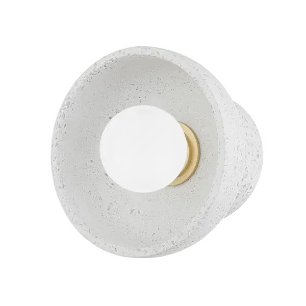The Margaret Wall Sconce showcases blue-grey terrazzo with natural texture, complemented by elegant Aged Brass details. Part of the Megan Molten x Mitzi collaboration, it pairs beautifully with artwork and adds warmth to any space.