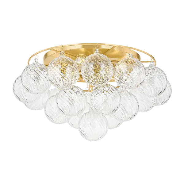 The Mimi Flush Mount features stunning swirl-ribbed champagne glass globes suspended from an Aged Brass frame, creating a sophisticated cloud-like effect. Perfect for adding soft, glamorous lighting to entryways and smaller spaces.