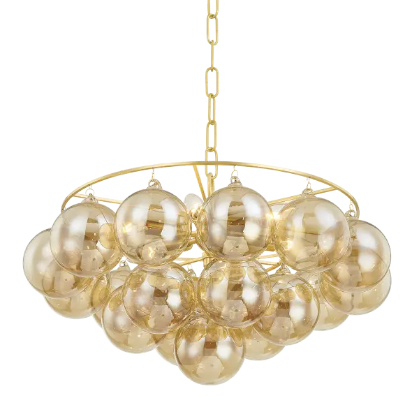 The Mimi Chandelier features swirl-ribbed champagne glass globes suspended from an Aged Brass frame, creating a sophisticated cloud-like effect. Part of the Megan Molten x Mitzi collaboration, it brings soft glamour to dining rooms, entryways, and breakfast nooks.