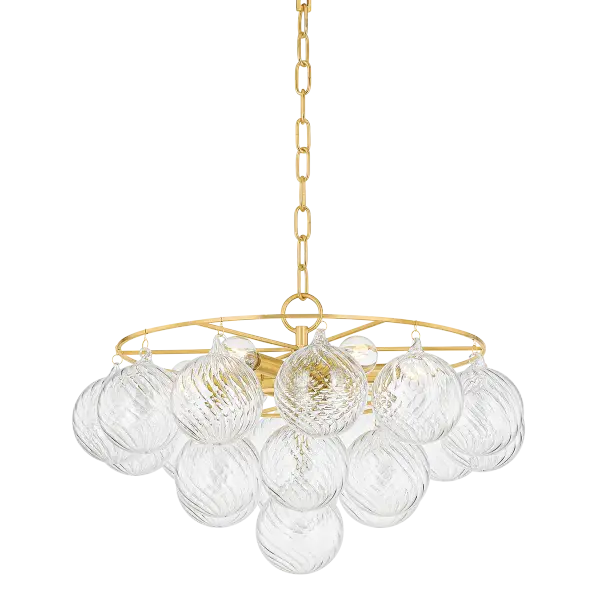 The Mimi Chandelier features swirl-ribbed champagne glass globes suspended from an Aged Brass frame, creating a sophisticated cloud-like effect. Part of the Megan Molten x Mitzi Tastemakers collection, this showstopper brings glamorous style and soft ambient lighting to any space.