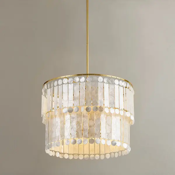 The Melisa Chandelier brings refined coastal style with gorgeous alternating circles and rectangles of Capiz shell suspended from an Aged Brass frame. Perfect for creating a sophisticated focal point in bedrooms and living spaces. - alternate view