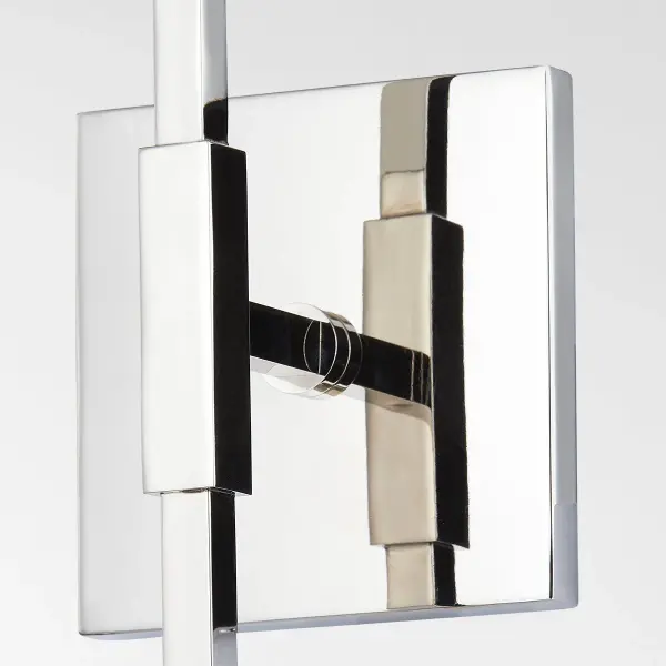 The Milana Wall Sconce makes a striking statement with its geometric design, featuring a square backplate and center arm that contrast beautifully with rounded sockets. The polished nickel finish adds contemporary elegance. - alternate view