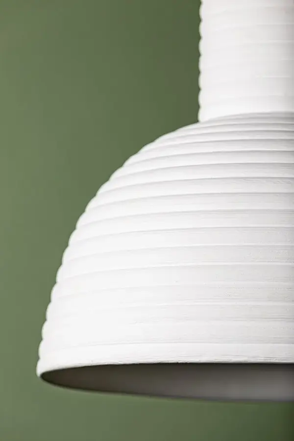 The Paloma Pendant brings artisanal pottery-inspired design to modern spaces. Its ceramic white-wash shade and aged brass accents create a warm, sophisticated focal point perfect for intimate dining areas and kitchen islands. - alternate view
