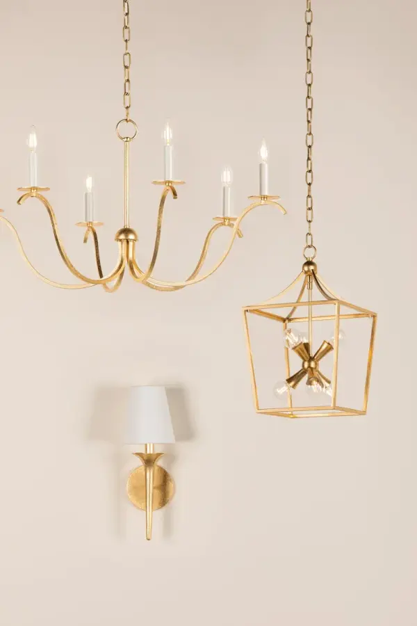 The Emily Wall Sconce brings organic elegance with its sculptural gold leaf arms and petal-like accents. White linen shades create a soft, warm glow perfect for intimate spaces. A versatile transitional design that works in both traditional and contemporary settings. - alternate view