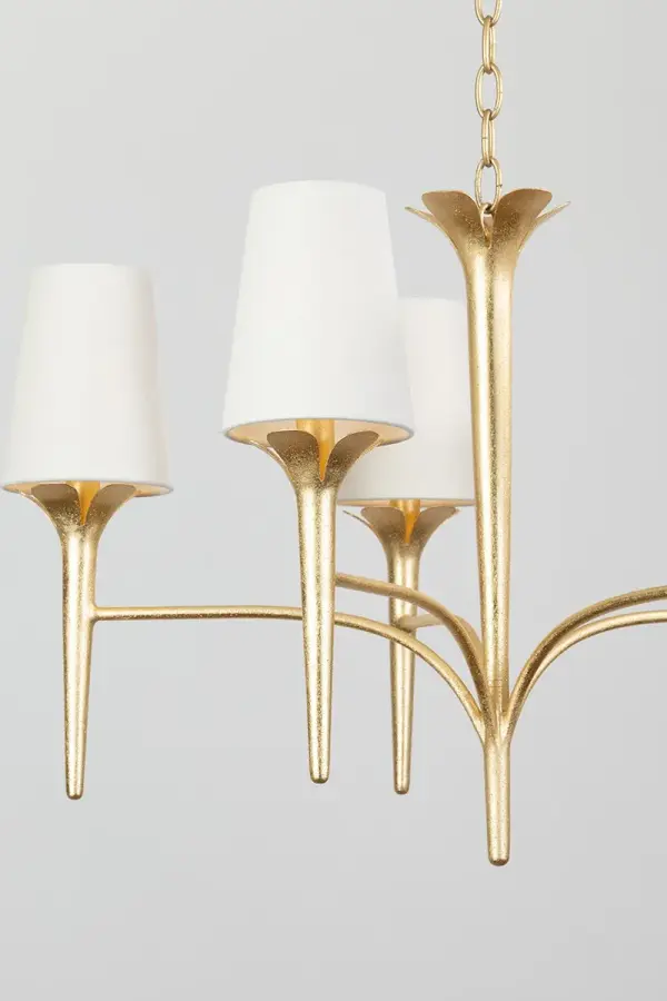 The Emily Chandelier brings natural elegance with its sculptural gold leaf arms and petal-like accents. Five tapered white linen shades create a soft, warm glow perfect for intimate dining or bedroom settings. - alternate view