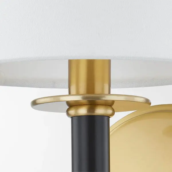 The Banyan Wall Sconce features an abstracted bamboo design that adds organic style and natural appeal. Part of the Ariel Okin x Mitzi collaboration, it offers sophisticated coastal-inspired lighting in a versatile aged gold brass finish. - alternate view