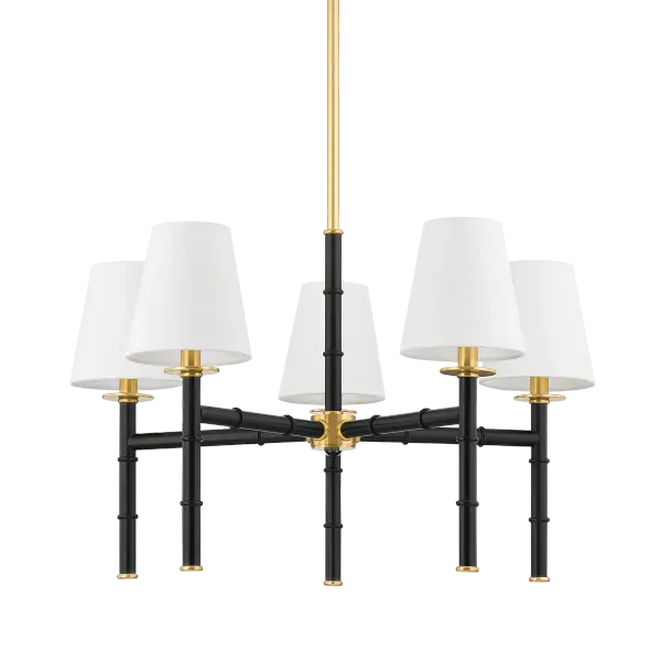 The Banyan Chandelier features an abstracted bamboo design inspired by Henry Link Bali Hai furniture, offering organic style with sophisticated metalwork. The aged gold brass and soft black finish combination provides versatility.