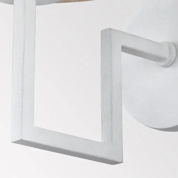 The Gladwyne Wall Sconce balances modern architectural lines with warm textile softness. Its clean angles and Natural Linen shade create a refined statement that complements multiple design styles. - alternate view