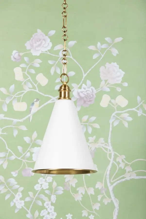 The Fenimore Pendant combines classic conical form with sophisticated details like an elegant shade topper and intricate chainwork. Part of the exclusive Ariel Okin collaboration, it features dual-tone finish with warm Aged Brass interior and crisp Soft White exterior for refined versatility. - alternate view