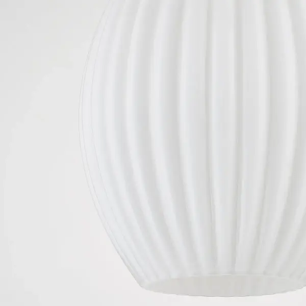 The Hillary Pendant brings cottage charm with its elegant fluted glass shade and aged brass finish. Perfect as a standalone piece or layered in multiples, this versatile fixture adds vintage character to kitchens and dining spaces. - alternate view