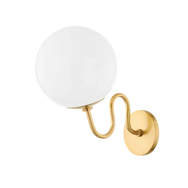 Art nouveau meets midcentury Italian, the Havana wall sconce and chandelier indulge in of-the-moment, whimsical design. Available in aged brass, old bronze, and polished nickel, Havana is engaged in shape play and features a wavy arm and glossy opal globe shade. Available in small and large chandelier.