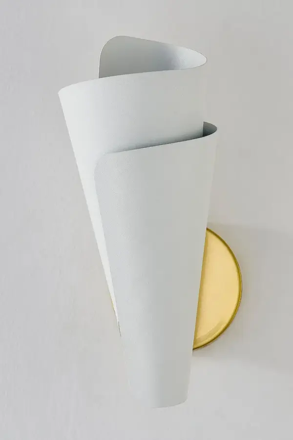 The Davina Wall Sconce transforms functional lighting into art with its spiraling textured white metal shade. Light filters through wrapped spaces creating a gorgeous ambient glow while illuminating walls beautifully. - alternate view