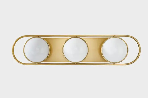The Amy vanity light brings a sophisticated jewelry aesthetic to bathroom spaces with opal glass spheres set in an elegant aged brass frame. Its versatile design allows both vertical and horizontal mounting for flexible placement. - alternate view