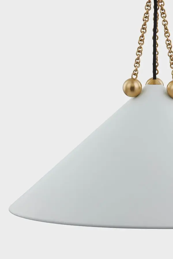 The Kalea Pendant masterfully blends Bauhaus-inspired geometry with bohemian ornamentation. Aged Brass chainwork and orb accents add jewelry-like detail to the clean, angular shade, creating a sophisticated focal point. - alternate view