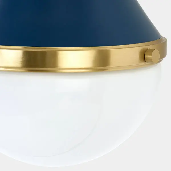 The Ciara Wall Sconce reimagines classic nautical design with a contemporary twist. Its teardrop silhouette combines a conical metal shade in refined Soft Navy with an opal glass diffuser, separated by an Aged Brass band. - alternate view