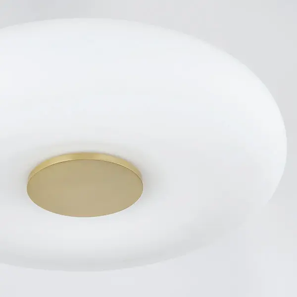 The Imani combines a soft fabric drum shade with an elegant aged brass center button, creating a sophisticated yet understated look. Its low-profile LED design makes it ideal for spaces with ceiling height constraints. - alternate view