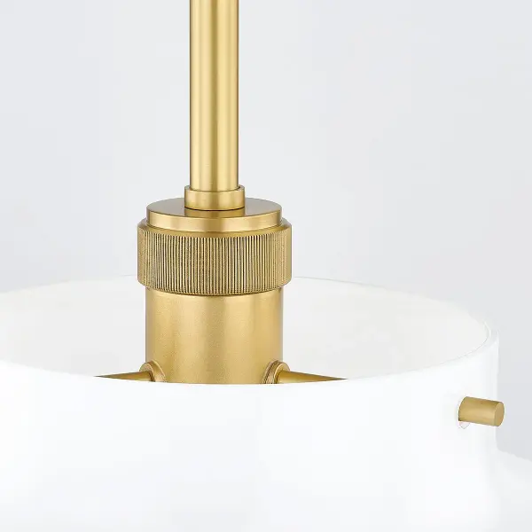 The Luella Pendant combines minimalist aesthetics with refined craftsmanship. Its opal glass shade provides soft, diffused light while knurled brass details add subtle visual interest. Perfect for modern spaces seeking understated elegance. - alternate view