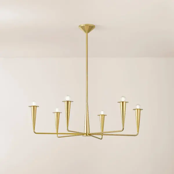 The Danna Chandelier masterfully blends industrial candlestick forms with botanical elegance and retro glass orbs. Its torch-like silhouette and clear glass spheres create dramatic visual interest while the aged brass finish adds warmth to modern interiors. - alternate view