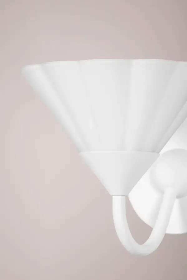 The Kelsey Wall Sconce combines artistic design with functional uplight, featuring softly ruffled opal etched glass on curved arms. Its clean Textured White finish creates a monochromatic aesthetic perfect for modern and transitional spaces. - alternate view