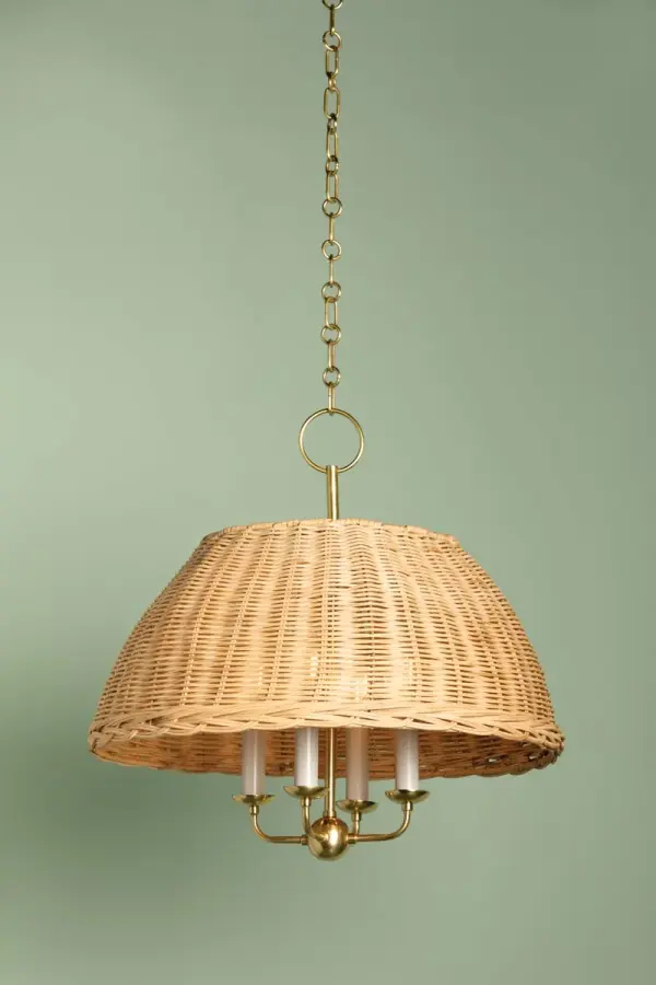 The Arwen Chandelier reimagines traditional lighting with natural rattan wicker intricately woven over a candle array, creating beautiful light patterns. Aged Brass accents add warmth and sophistication to this transitional piece. - alternate view