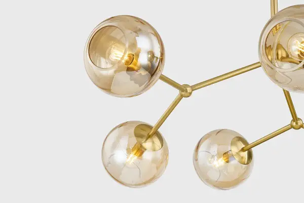 The Trixie Chandelier brings organic sophistication with its branching design and champagne swirl glass orbs. Decorative sphere joints add jewelry-like detail, while the iridescent finish creates visual interest both lit and unlit. - alternate view
