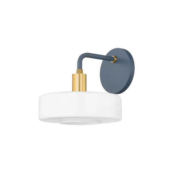The Aston Wall Sconce combines geometric modern design with unexpected color through its distinctive Slate Blue glass shades and warm Aged Brass accents. Part of the Zoe Feldman collection, this fixture balances contemporary aesthetics with timeless appeal.