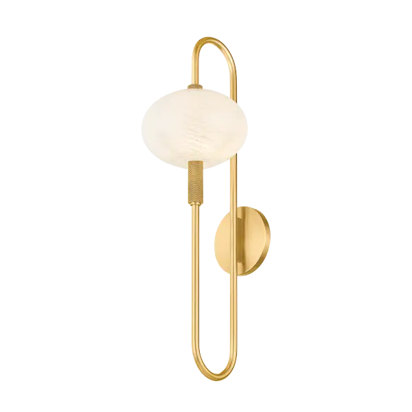 The Delphine Wall Sconce combines vintage charm with modern sophistication through its distinctive looping racetrack arm and opal glass shade. Knurled details add decorative interest to the aged brass frame.