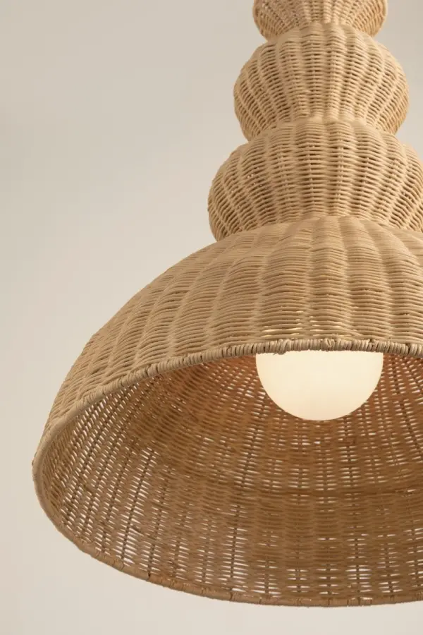 The Mayla Pendant brings organic texture and coastal elegance to any space with its handwoven rattan shade and aged brass chain. Inspired by rippling water, this statement piece filters light beautifully while adding natural warmth. - alternate view