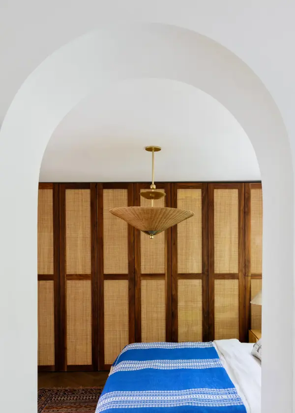 The Perilla Pendant masterfully blends natural wicker rattan with aged brass metalwork, creating a sophisticated focal point. Part of the exclusive Dabito x Mitzi collaboration, it brings warmth and artisanal character to contemporary spaces. - alternate view