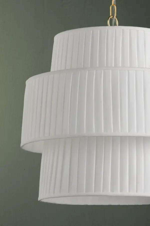 The Rya Pendant combines architectural drama with soft elegance through its tiered, pleated linen design. This oversized fixture creates a stunning focal point while diffusing warm, ambient light throughout the space. - alternate view