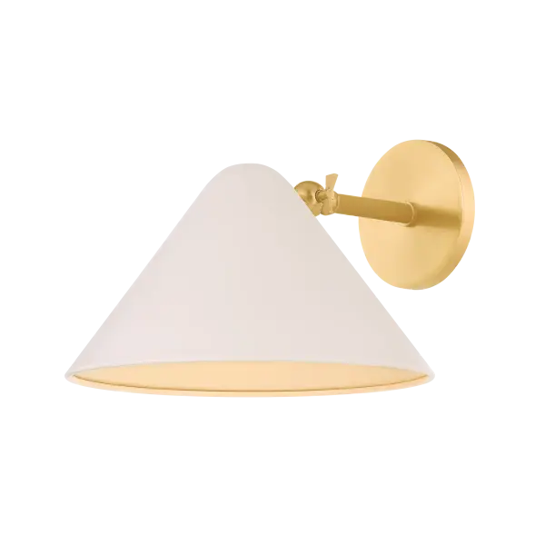 The Sonja Wall Sconce blends mid-century charm with modern simplicity through its rounded geometric form and soft bisque shade. Perfect for creating ambient lighting in intimate spaces with its warm aged brass finish.