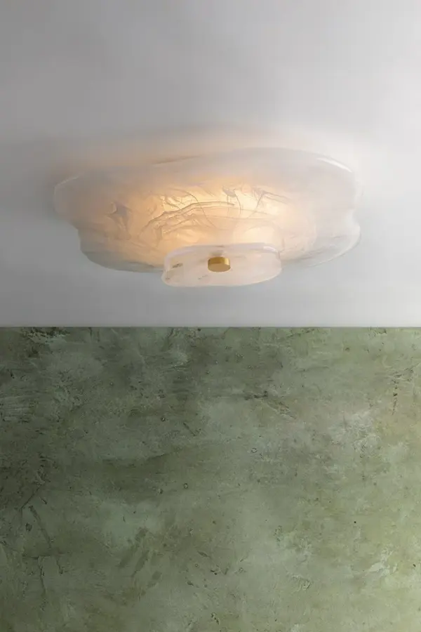 The Starlie flush mount transforms ceilings into blooming art with its petal-like layers of swirled Piastra glass. Soft, diffused light filters through organic curves, while an ornamental brass finial adds sophisticated warmth. - alternate view