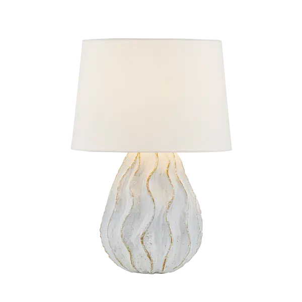 The Karla table lamp brings organic coastal elegance to any space with its whimsical coral-inspired silhouette. Hand-crafted ceramic construction features flowing raised edges and muted pastel tones that showcase natural earthy hues.