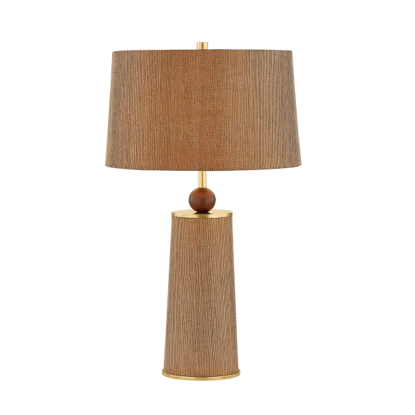 The January Table Lamp beautifully blends natural materials with contemporary form. Its woven jute shade, walnut wood sphere, and aged brass accents create a warm, textural statement piece that adds organic sophistication to any space.