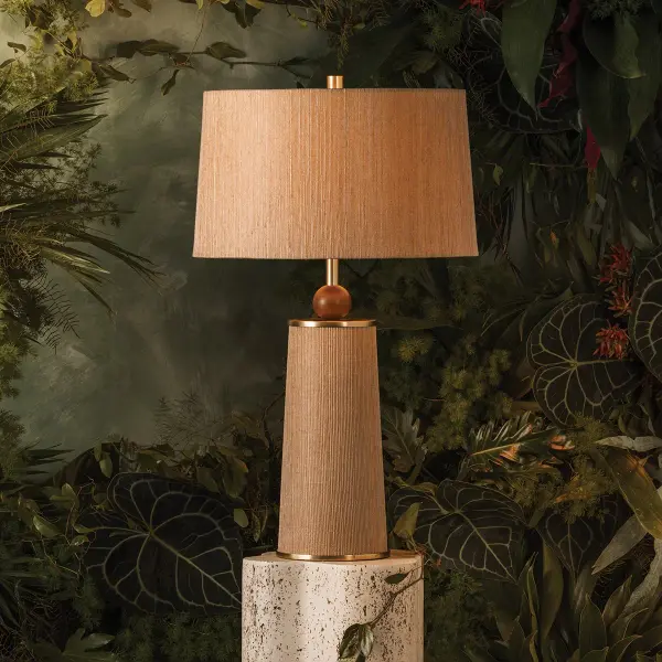 The January Table Lamp beautifully blends natural materials with contemporary form. Its woven jute shade, walnut wood sphere, and aged brass accents create a warm, textural statement piece that adds organic sophistication to any space. - alternate view