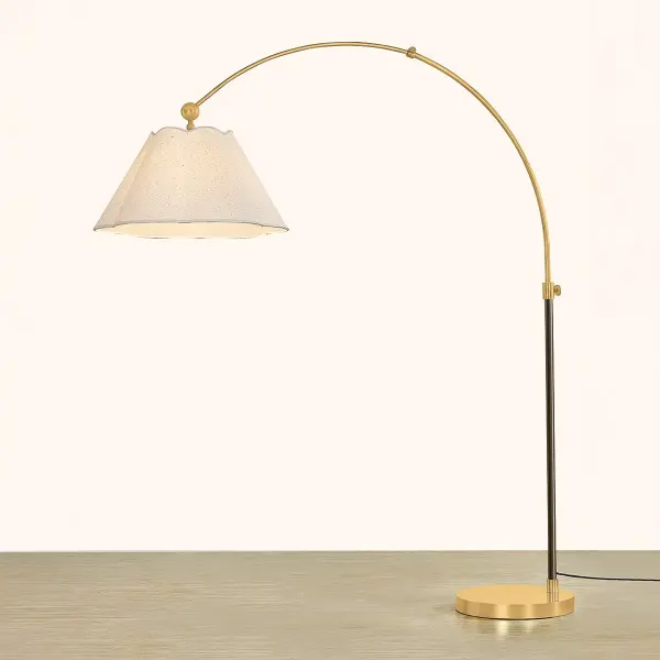 The Janie Floor Lamp beautifully bridges traditional and contemporary design with its scalloped fabric shades and striking Aged Brass and True Bronze finish combination. Perfect for layered lighting schemes in classic or modern interiors. - alternate view