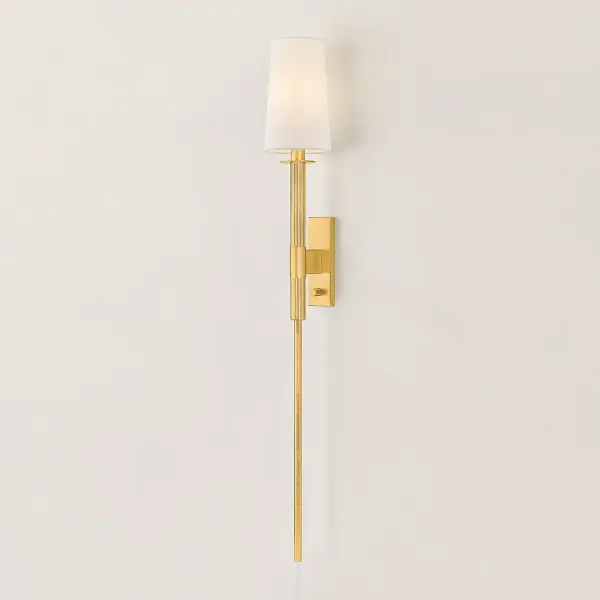 The Ginny Plug-In Sconce offers a sophisticated solution for spaces where hardwiring isn't feasible. Its clever cord-concealing design creates a luxurious, built-in appearance while the aged brass finish and white linen shade deliver timeless elegance. - alternate view