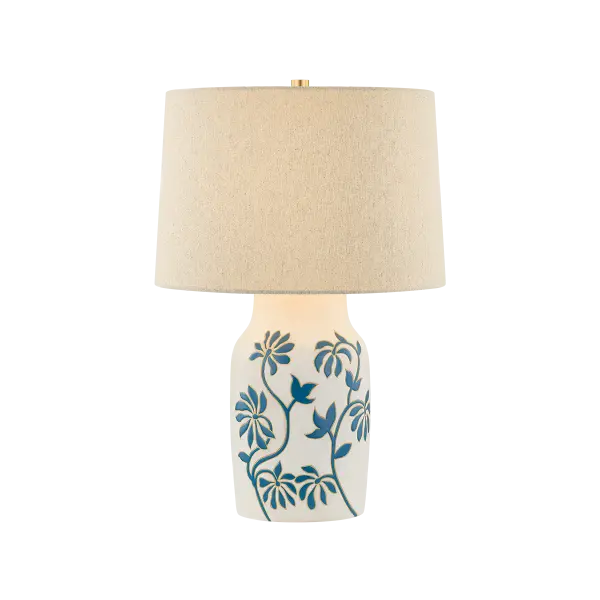 The Yazmeen brings artisanal charm with its hand-glazed ceramic base featuring the distinctive Whitney Floral motif. Each piece is unique, offering one-of-a-kind character paired with a warm sandstone linen shade for organic sophistication.