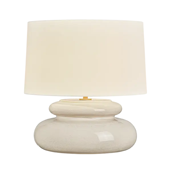 An exploration of voluminous forms and soft, endearing colors, the Pia family leans into the playful side of lighting. Stout proportions, generous curves, and stacked ceramic disc shapes lend an artisanal feel that is enhanced by the Butter Crackle and Chateau Crackle finishes. The table lamp is topped with a classic white linen drum shade, while the pendant, flush mount, and wall sconce cast light through a large oculus. Finished with Aged Brass hardware, this family adds artistic visual interest to any space. Part of our Hilary Matt x Mitzi Tastemakers collection. Collection: Pia Designer: Hilary Matt Finish: Aged Brass Glass: White Linen Width: 19.50" Height: 20.00" Weight: 14.11 lb Number of Bulbs: 1 Maximum Wattage: 15.00 W Bulb Type: A19 Bulb Base: E26 Medium Voltage: 120.00 V Material: Ceramic Country of Origin: VN Safety Listing: UL/cUL Safety Rating: Dry Switch: FULL RANGE DIMMER ON SOCKET Manufacturer Warranty: 1 Year Limited Manufacturer Spec Sheet Instructions