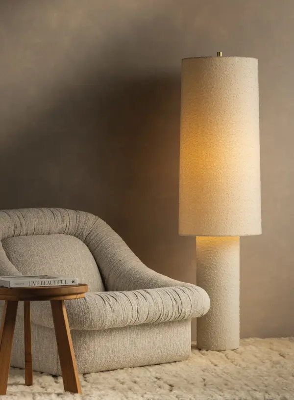The all-over soft ivory boucle of the Sam family of lamps creates an inviting addition to modern interiors. As a table lamp, Sam makes a minimalist statement on a sideboard, while the floor lamp warms up a bedroom or reading nook with ease. The playful vertical proportions of both the table and floor lamp make them ideal for more narrow spaces. Concealed Aged Brass hardware lends a luxe finish to both of these textural lamps. Part of our Hilary Matt x Mitzi Tastemakers collection. Collection: Sam Designer: Hilary Matt Finish: Aged Brass Glass: Textured Linen Width: 15.00" Height: 55.25" Weight: 14.55 lb Number of Bulbs: 1 Maximum Wattage: 15.00 W Bulb Type: A19 Bulb Base: E26 Medium Voltage: 120.00 V Material: Linen Country of Origin: VN Safety Listing: UL/cUL Safety Rating: Dry Switch: ON/OFF STOMP SWITCH Manufacturer Warranty: 1 Year Limited Manufacturer Spec Sheet Instructions - alternate view