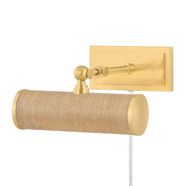 The Holly Picture Light combines traditional aged brass with natural grasscloth for a sophisticated look. Perfect for highlighting artwork or wall displays, this plug-in fixture offers focused illumination with style-forward design.
