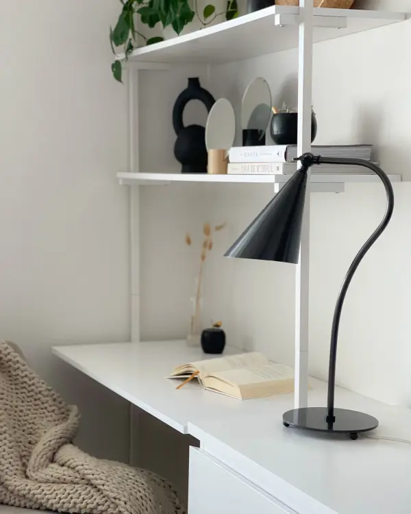 The Lupe table lamp combines utilitarian function with refined style. Its adjustable gooseneck arm and swivel key provide precise directional lighting, making it perfect for reading, working, or accent lighting. - alternate view