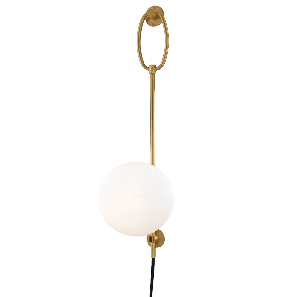 The Gina Plug-In Sconce combines classic elegance with modern convenience. Its aged gold brass finish and glass globe shade create warm, ambient lighting without hardwiring requirements.