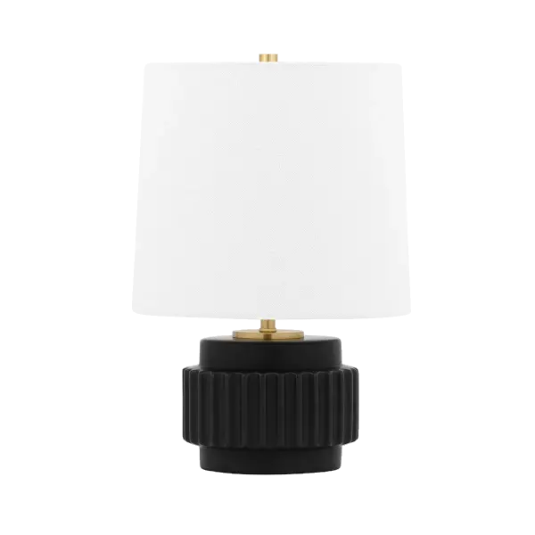 The Kalani Table Lamp offers a refined transitional design that bridges traditional and contemporary aesthetics. Its bronze finish provides warmth and sophistication, making it adaptable to various interior styles.