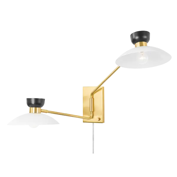 The Whitley sconce features a striking yin-yang glass shade design with black and white tones, complemented by an aged brass swing arm. Perfect for task lighting over desks or reading areas with plug-in convenience.
