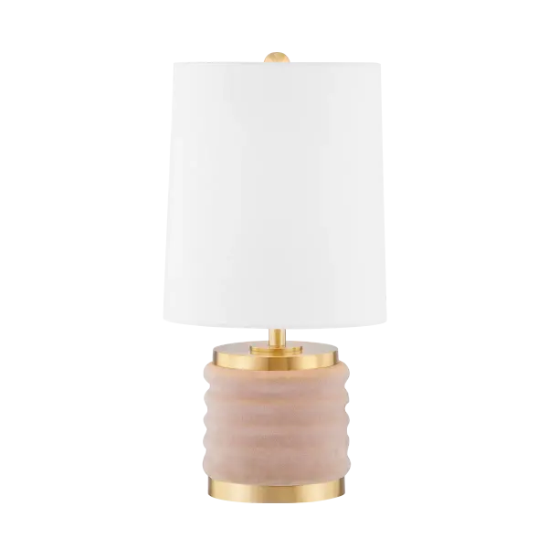 The Bethany Table Lamp combines nostalgic velvet curves with refined aged brass detailing. Its petite size and soft blush velvet base create a sophisticated yet playful accent perfect for intimate spaces.