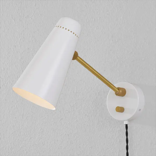 The Alex Plug-In Sconce brings authentic mid-century design to any space without hardwiring hassles. Its aged brass finish paired with perforated shade creates warm, ambient lighting perfect for bedrooms, offices, or hallways. - alternate view