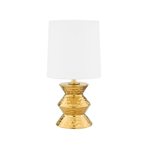 The Zoe Table Lamp brings artisanal elegance to any space with its stacked ceramic gold base featuring a distinctive dimpled texture. The white linen drum shade provides soft, diffused light while the metallic finish beautifully reflects ambient illumination.