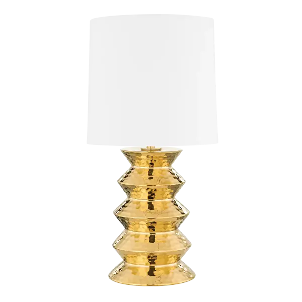 Inspired by global folk art, Zoe is both familiar and surprising. The stacked silhouette of this sophisticated table lamp gets a luxe look in ceramic gold. The metallic base has a dimpled surface that adds texture and beautifully reflects the light coming from the white linen drum shade.