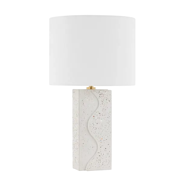 The Cort Table Lamp brings artistic sophistication with its terrazzo ceramic base featuring undulating wave-like curves. Aged brass hardware adds warmth while the white linen shade provides soft, diffused light.